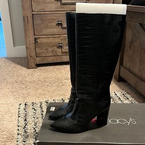 Tall faux alligator print boots.